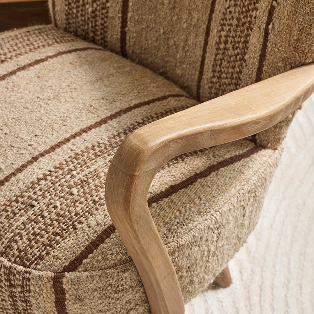 CALVIN IN BROWN STRIPED RUG