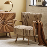 CALVIN IN BROWN STRIPED RUG